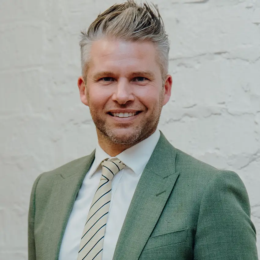 Chris Robinson — Tommy's Real Estate logo